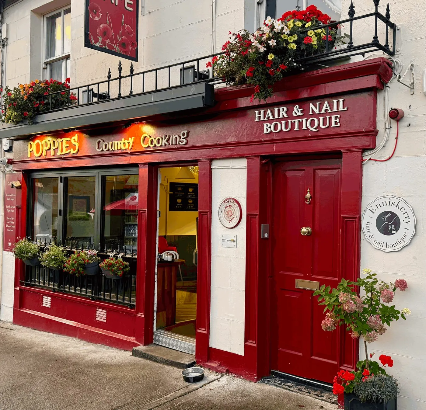 Our red door on The Square, right beside the entrance to Poppies café